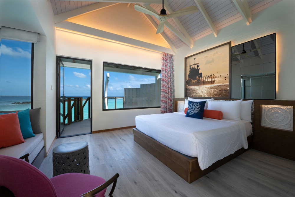 OBLU XPERIENCE AILAFUSHI - WATER VILLA - BEDROOM WITH VIEW.jpg
