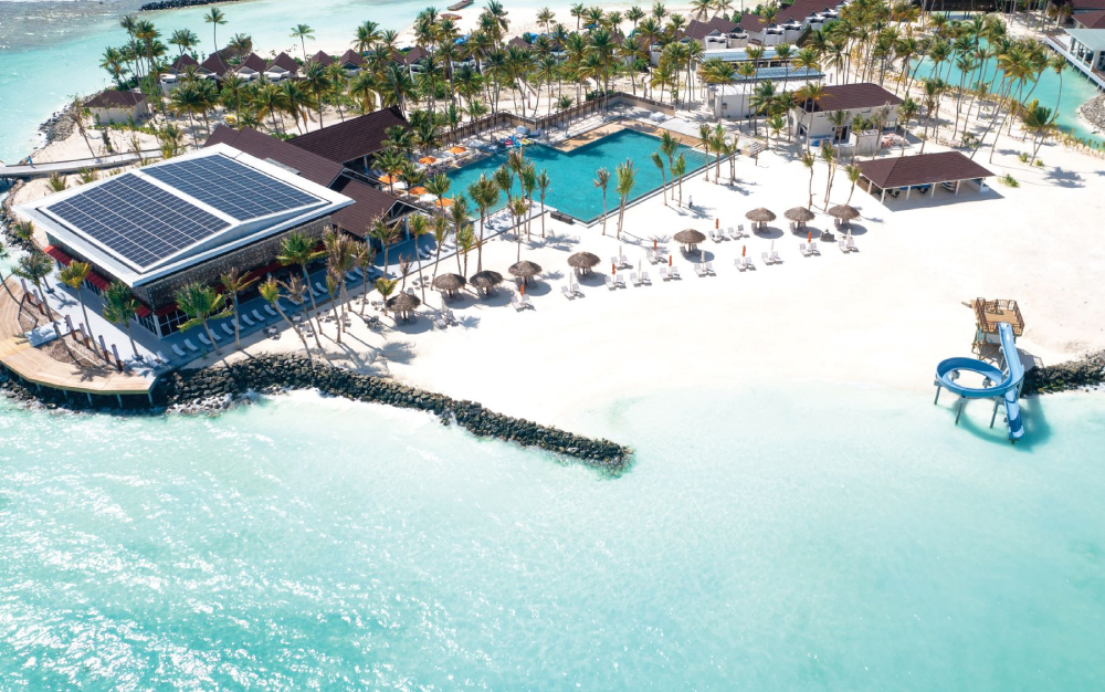 OBLU Xperience Ailafushi - Aerials and Generic - Arrival Jetty and Pool Bar Aerial 01.jpg