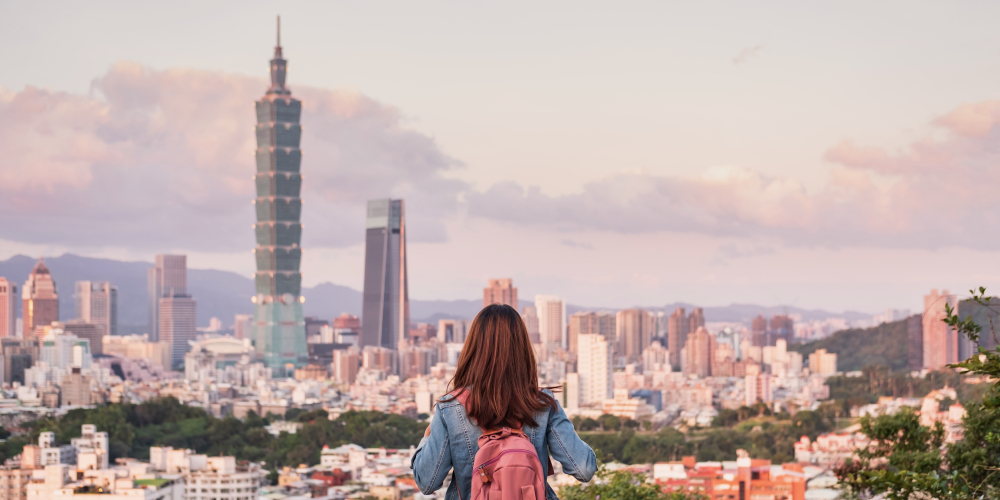 young-woman-traveler-looking-beautiful-cityscape-a-2023-11-27-04-52-49-utc (1).jpg